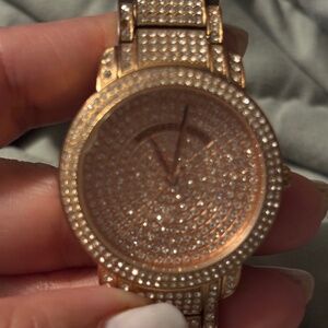 Pair of authentic Michael Kors woman’s watch with stunning pave stone de